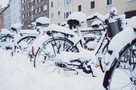 bicycles-in-snow-near-houses-2022-03-04-05-39-43-utc