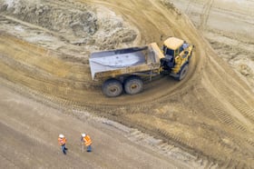 big-yellow-excavator-at-a-road-construction-site-2021-08-27-11-05-09-utc