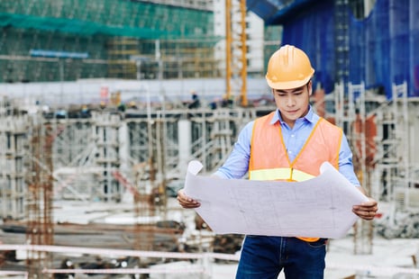 civil-engineer-examining-building-plan-2021-08-26-19-52-16-utc