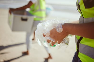 cleaning-plastic-and-hands-of-volunteer-at-beach-2023-01-12-19-21-03-utc