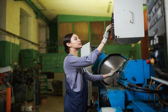 female-worker-controlling-the-work-of-machine-2022-02-02-03-58-34-utc