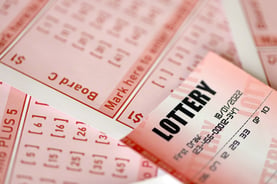 red-lottery-ticket-lies-on-pink-gambling-sheets-wi-2022-11-12-14-56-41-utc