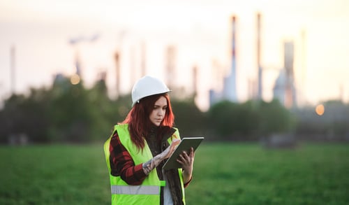 young-woman-engineer-with-tablet-standing-outdoors-2022-02-02-04-48-51-utc