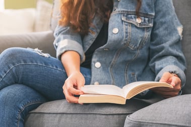 closeup-image-of-a-woman-sitting-and-reading-a-vin-2022-10-06-22-34-18-utc