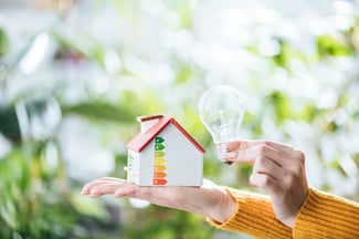 cropped-view-of-woman-holding-led-lamp-and-carton-2022-11-02-03-53-00-utc