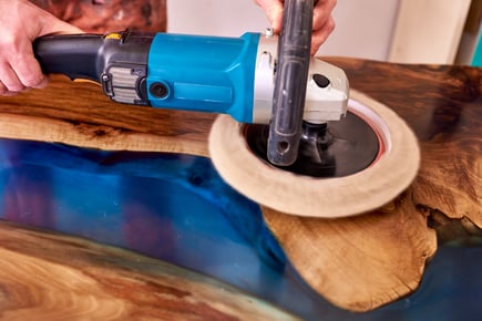 man-polishing-epoxy-table-close-up-2021-10-21-18-30-06-utc