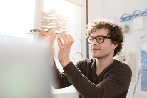 portrait-of-young-architect-looking-at-architectur-2024-09-18-10-46-30-utc