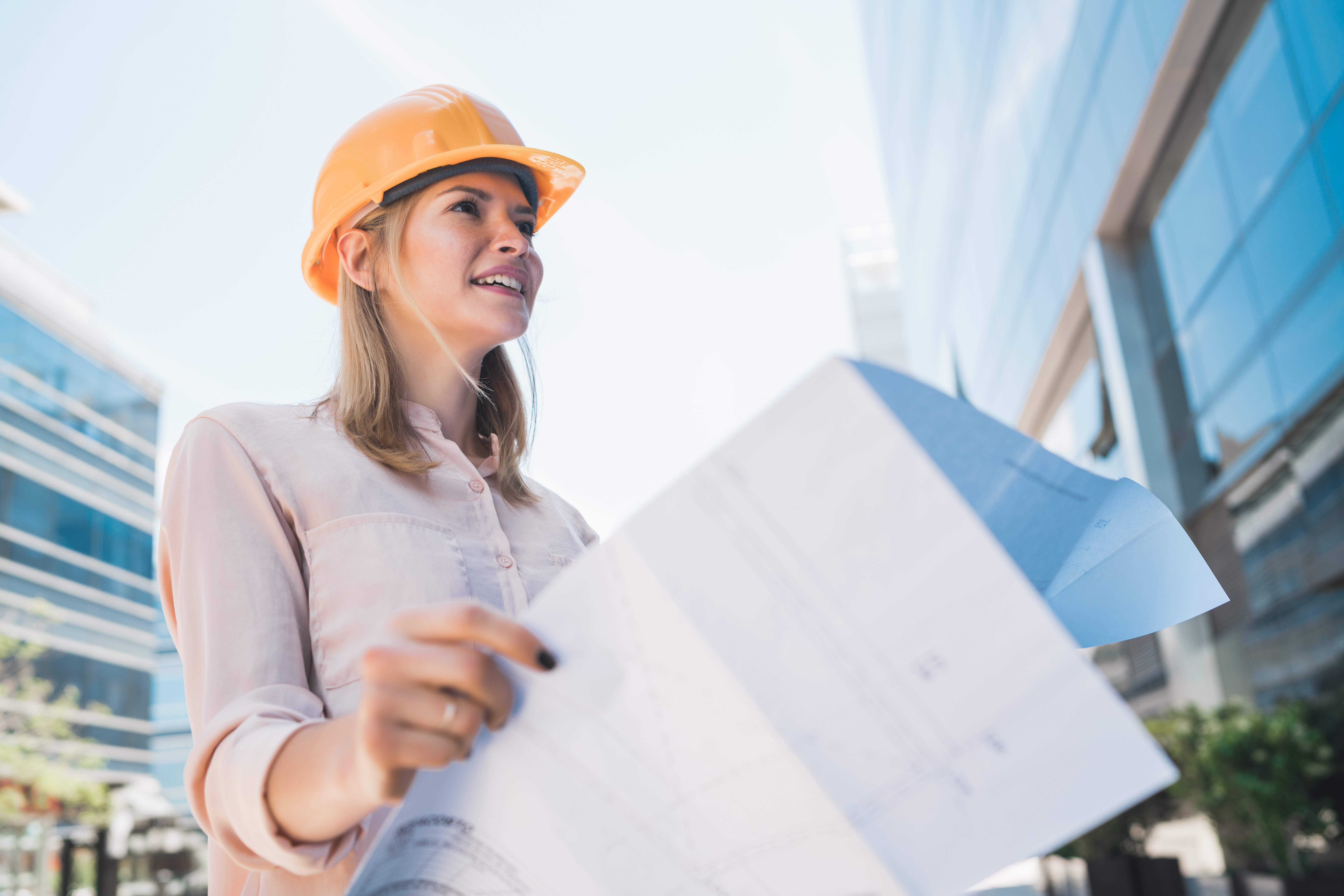 professional-architect-holding-blueprints-outdoors-2021-08-28-11-00-04-utc