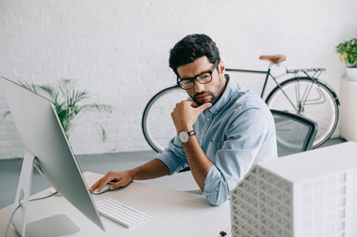 serious-handsome-architect-using-computer-and-look-2024-11-01-00-43-06-utc